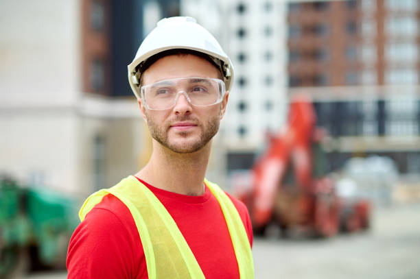istock Serene builder in protective eyewear standing on the building site 1332251286