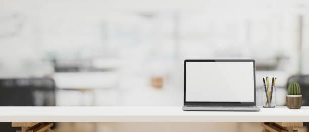 istock Laptop mock up, decor and copy space on minimal white working desk 1332252303
