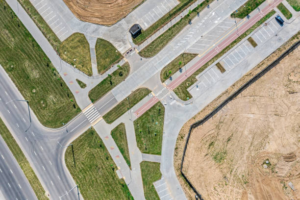 istock road intersection, sidewalk and parking lots, view from above with drone. newly constructed urban road 1332253668