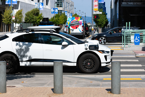 Waymo Jaguar I-Pace self driving car performing tests on urban street. - San Francisco, California, USA - 2021