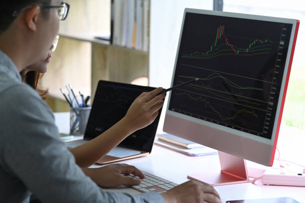 istock Businesspeople analyzing finance data graphs on screen of computer together. 1332255771