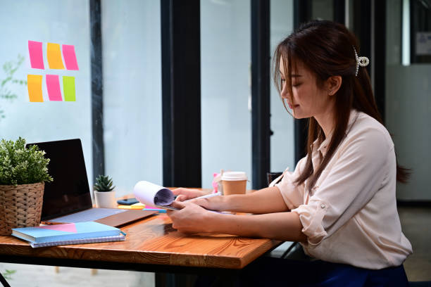 istock Side view young woman working in creative office. 1332255932