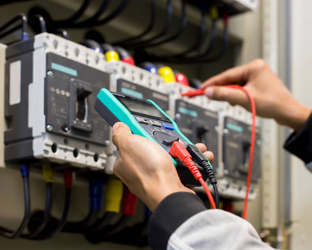 istock An electrician checks the operation of the electrical control cabinet. 1332256830