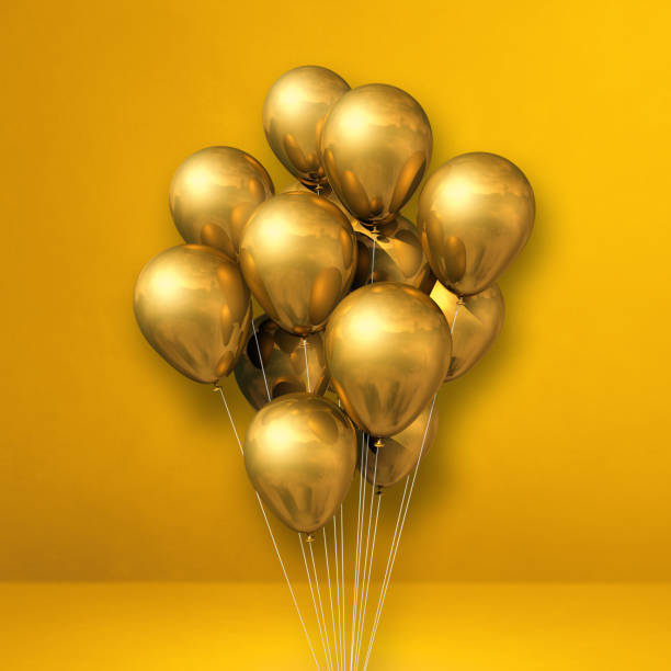 istock Gold balloons bunch on a yellow wall background 1332263220