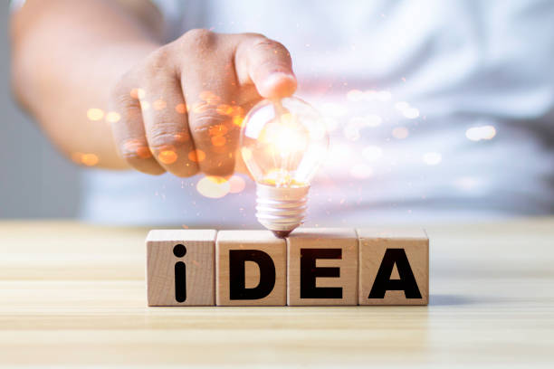 istock hand touching on light bulb with connection line. new idea saving energy and innovative technology in science and communication concept. 1332269184