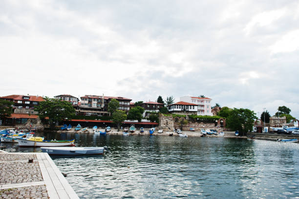 istock Small fish boats on old port Nessebar. 1332272469