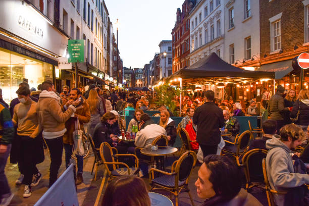 busy bars and restaurants in soho at night, london, uk - praça leicester imagens e fotografias de stock