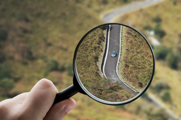 istock Magnifying glass focusing a car on a road 1332274156