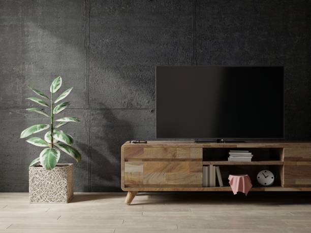 istock Loft space empty room with tv cabinet on dark concrete interior background. 1332274939