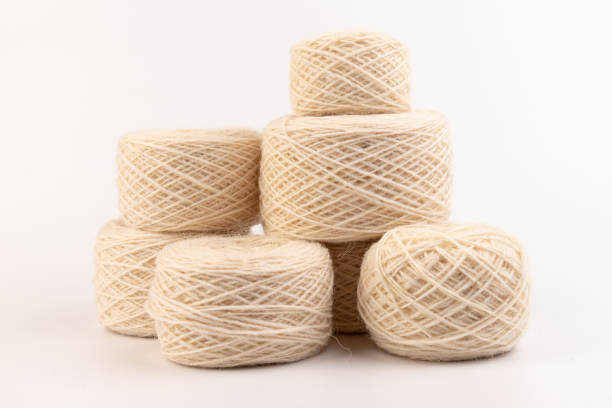 istock balls of light woolen thread on white background. natural wool. knitting. background 1332277042