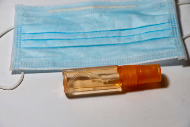 istock medical mask and hand sanitiser 1332277803