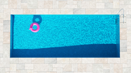 Blue Swimming Pool Aerial view with a Pink Flamingo Inflatable Donut Rubber Ring with white Stone Surround Top View 3d illustration render