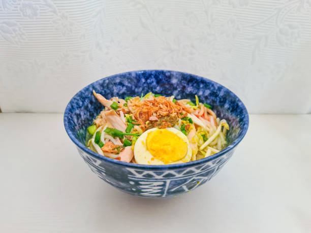 istock Homemade Mee Soto, Indonesian chicken soup noodles, sumptuously garnished 1332280098
