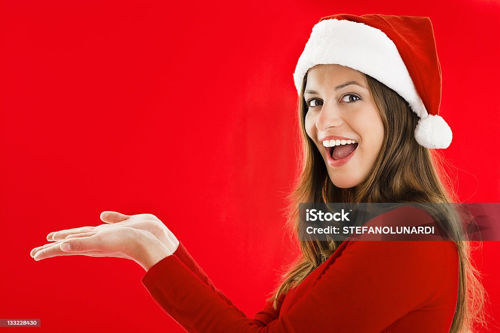 Entusiasta Santa ragazza mostrando qualcosa - Foto stock royalty-free di Donne