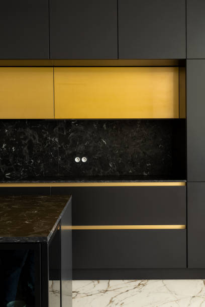 istock Black kitchen with golden details 1332286796