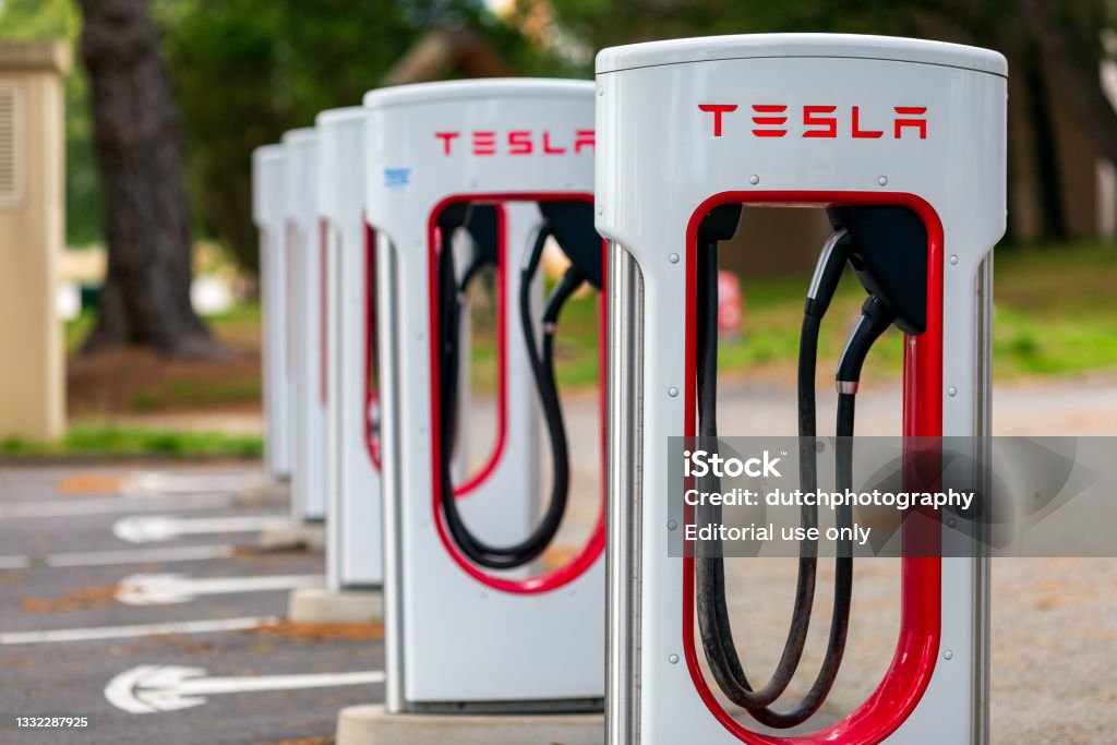 Tesla Supercharger Station Lorient, Bretagne, France. July 30th, 2021 - Tesla Supercharger station and parking located at the Formule 1 hotel at Lorient. Supercharged Engine Stock Photo