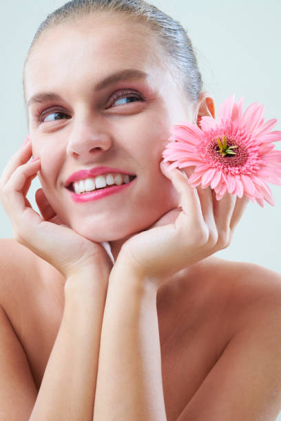istock Young Woman With Gerbera 1332289072