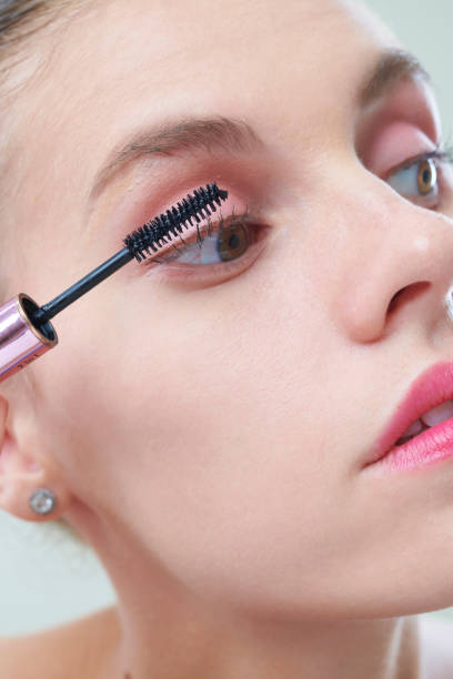 istock Woman Applying Mascara 1332289079