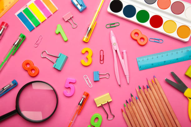 istock School supplies on pink background. Back to school concept. 1332292634