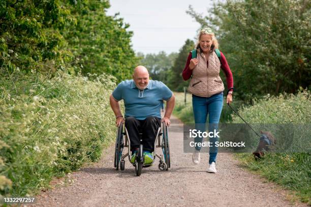 Using My Wheelchair On A Dog Walk Stock Photo - Download Image Now - Wheelchair, Disability, Footpath