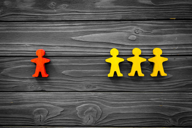 istock Keep distance concept. Wooden figures on social distancing. Top view 1332297272