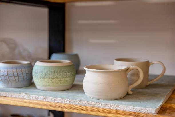 istock Handmade Ceramic Pottery. White, not painted clay pottery. Creative studio potter. 1332299928