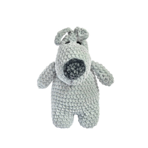 istock crocheted doggie isolated on white background. Soft decorative children's toy. Needlework. 1332300520