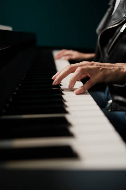 istock Woman hands playing keyboard at the studio 1332300522