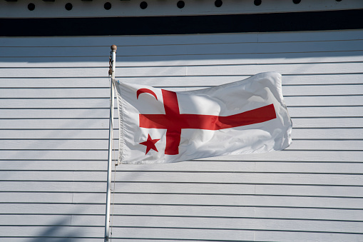 Vienna, WIEN, Austria - August 23, 2023: Austrian and European flag on the roof of ancient palace