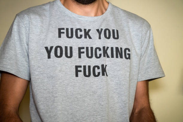 istock Unrecognized young man wearing an insulting t-shirt. 1332302001