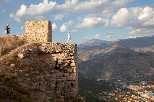 City view with historical Amasya castle.A group of tourists tour the castle.Amasya,Turkey.4 October 2015