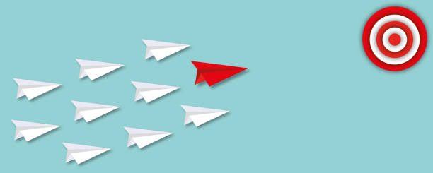 istock White paper planes follow red paper plane hitting in the target on pastel green background. 1332303355