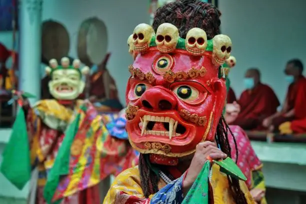 This is an image clicked in Ladakh Monestery where the artist are performing folk dance