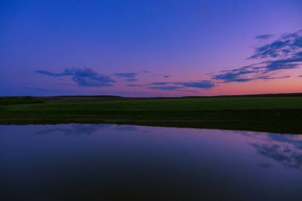night on the lake among the fields in summer