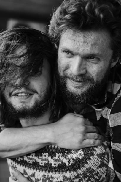 istock Strong portrait of two men hugging 1332307250