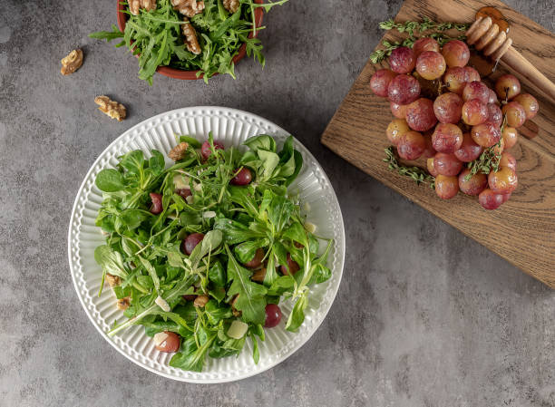 istock Delicious salad made from caramelized roasted grapes, peppery arugula, toasted walnuts, and pecorino cheese. 1332313981