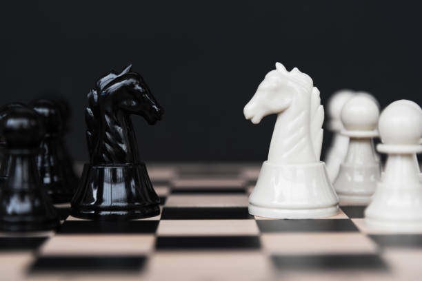 Competition - knight kingdom chess White Chess Pieces on Black Background chess board photos stock pictures, royalty-free photos & images