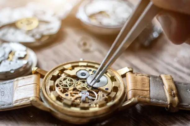 Mechanical watch repair. Watchmaker repairs vintage mechanical watches. Watchmaker's workshop.