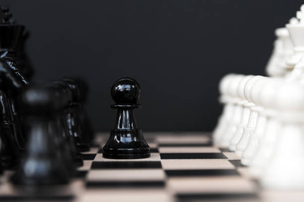 istock Black pawn against the White Chess Set 1332315704