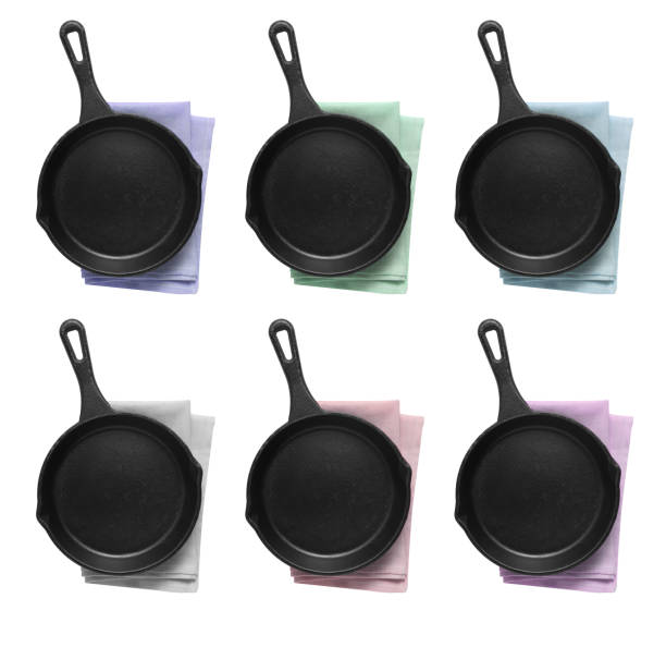 istock Empty iron pan and napkin isolated on white background 1332320142
