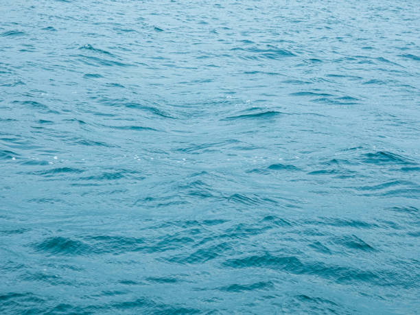 istock Sea water background with waves and splash. 1332324699