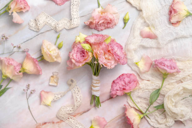 istock Pink flowers bouquet on marble table 1332329164