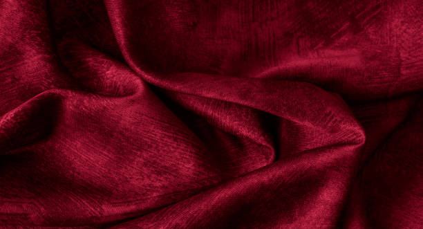 istock Crinkled red cotton fabric with visible texture 1332331504