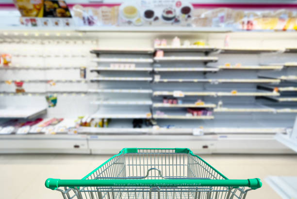 Empty shelves in supermarket store due to novel coronavirus covid-19 outbreak panic in thailand. stock photo