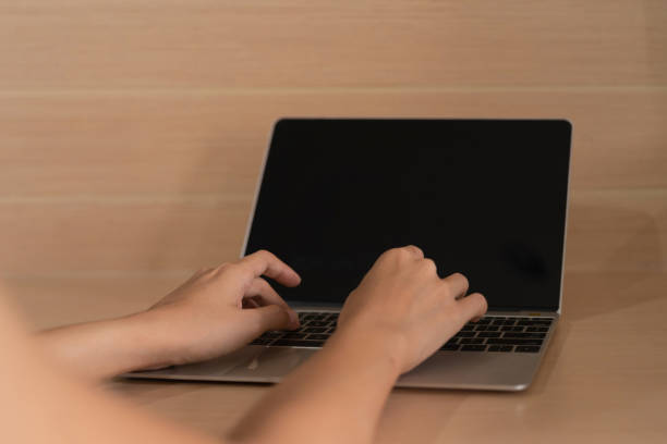 istock Business people working, typing on a keyboard with blank empty screen monitor on computer laptop notebook in technology device concept. Lifestyle 1332332528
