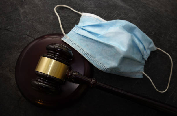 Court legal gavel and facemask -- Coronavirus mask mandate concept Court legal gavel and facemask -- Coronavirus mask mandate concept mandate photos stock pictures, royalty-free photos & images