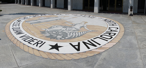 The front entrace of the North Carolina State Legislature building in Raleigh with the state seal and motto - Esse Quam Videri -- To Be, Rather Than To Seem