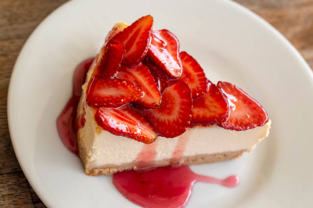 Piece of cheesecake with fresh strawberries