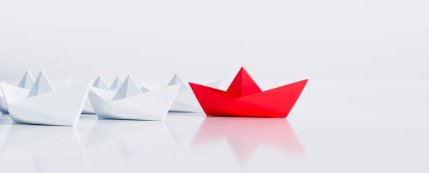 istock Paper boats - Thinking concept differently - Changing course - new ideas 1332334307