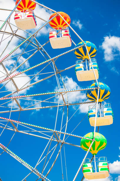 istock Ferris Wheel with Blue Sky and clouds 1332335359